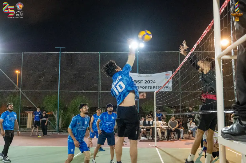 A volleyball rally at the net